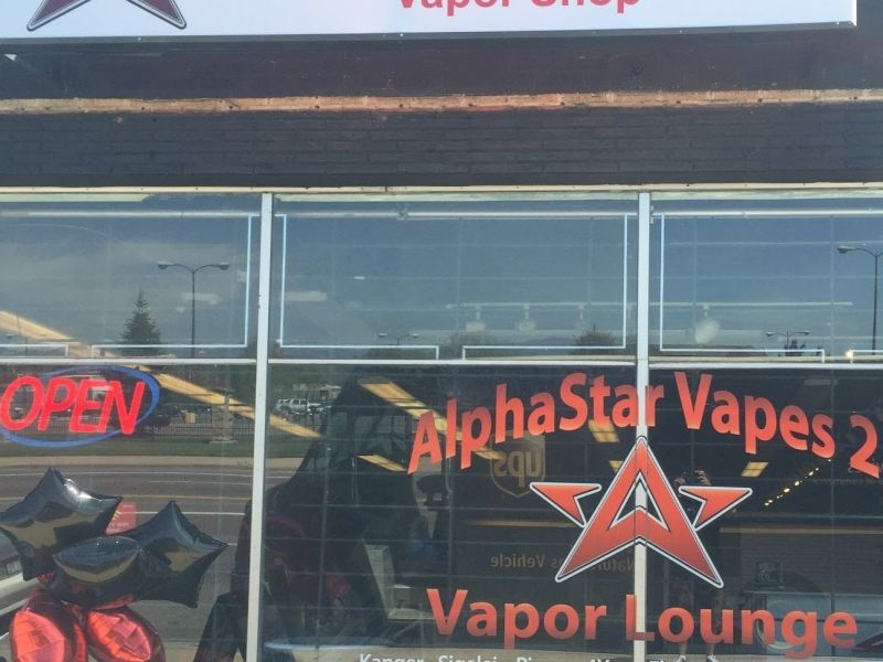 vape shops in brighton The Evapo shop in North Street Brighton specialising in CBD and Vaping  solutions with a sign above claiming vaping is 95 percent less harmful than  smoking Stock Photo main image 1